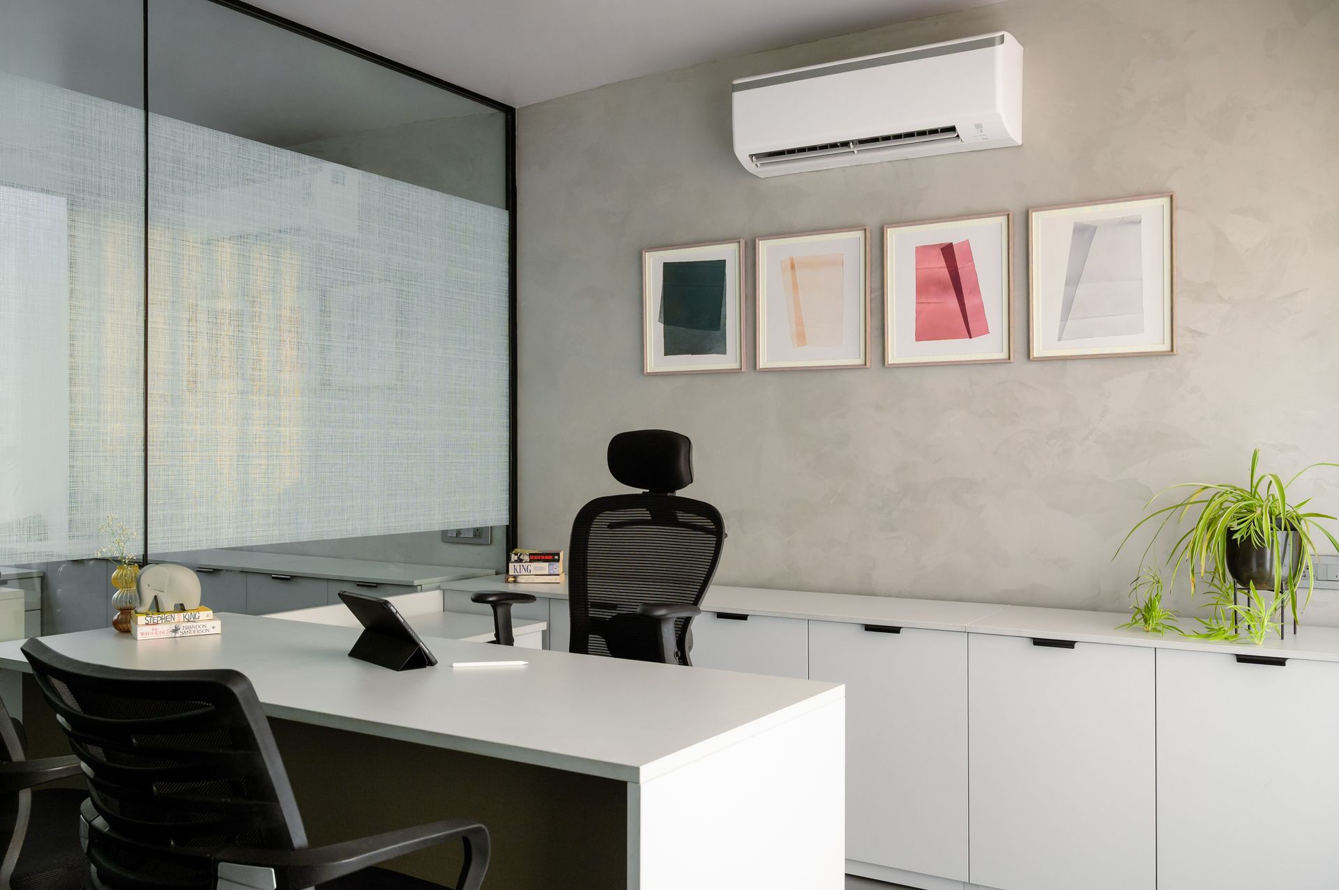 Contemporary office space with a sleek desk and modern decor, perfect for a professional setting.